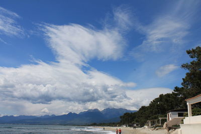 Scenic view of mountains against cloudy sky