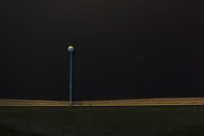 Street light against sky at night