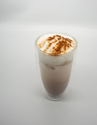 Close-up of coffee cup against white background
