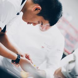 Close-up of person preparing baby