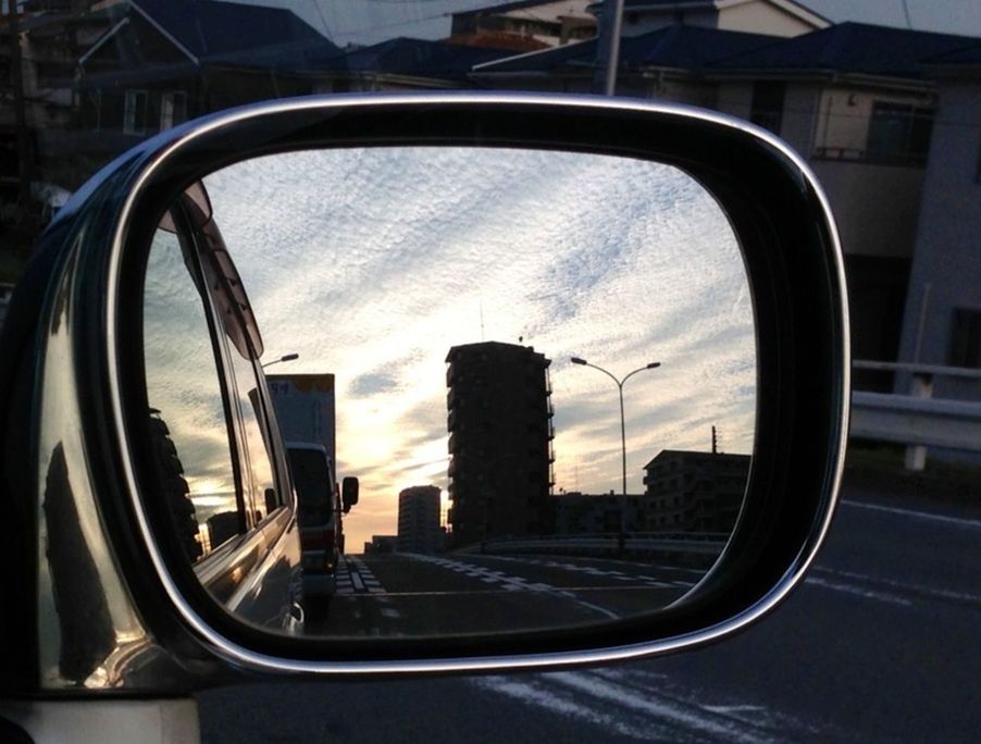 sky, architecture, building exterior, built structure, transportation, city, reflection, car, window, glass - material, cloud - sky, land vehicle, street, mode of transport, road, transparent, cloud, no people, day, building