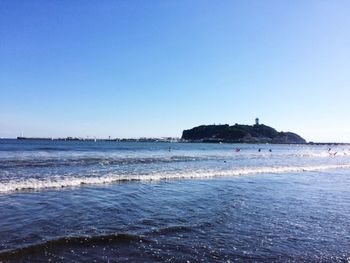 Scenic view of calm sea against blue sky