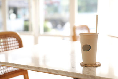 Close-up of coffee cup on table