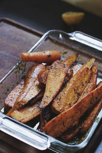 High angle view of glazed carrots in tray