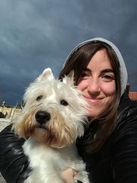 Portrait of young woman with dog