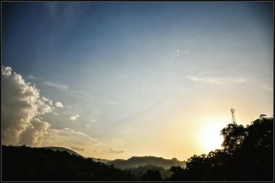 Scenic view of landscape against sky at sunset