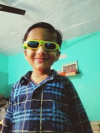 Portrait of boy standing in swimming pool