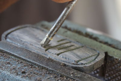 High angle view of tool on wood