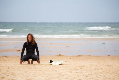 Full length of man at beach against sky