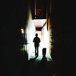 Full length of woman walking on wall