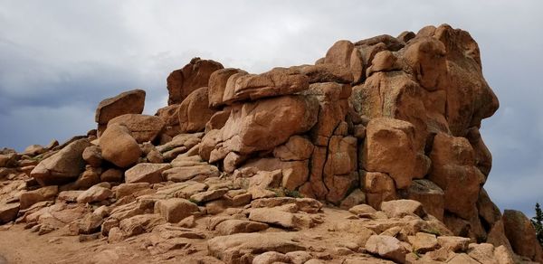 Low angle view of rock formation at pikes peak against sky