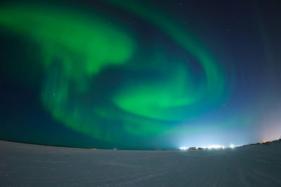 Scenic view of landscape against sky at night