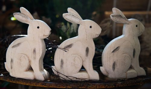 Close-up of statues on table at night