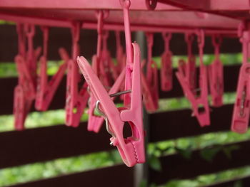Close-up of clothespins hanging on clothesline