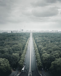 Aerial view of highway in city against sky