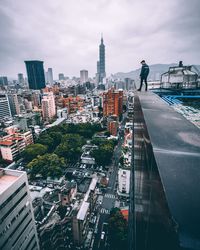 High angle view of city against cloudy sky