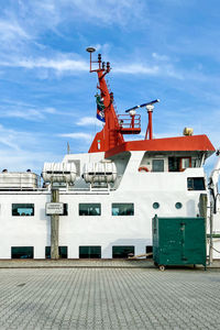 Ship at harbor against sky