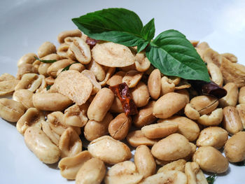 High angle view of roasted coffee beans in bowl