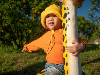 Close-up of cute girl playing in park