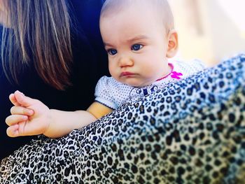 Midsection of mother with cute baby girl