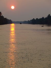 Scenic view of calm sea at sunset