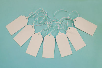 High angle view of paper against blue background