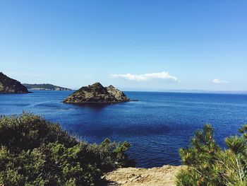 Scenic view of sea against blue sky