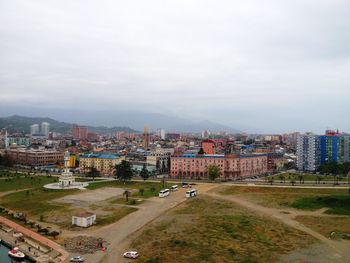 High angle view of city buildings against sky