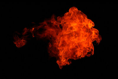 Close-up of bonfire against black background