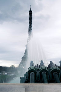 Low angle view of monument and building against sky