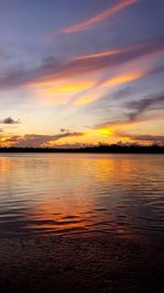 Scenic view of sea against romantic sky at sunset