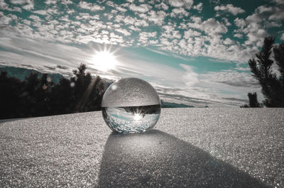 Close-up of crystal ball on road