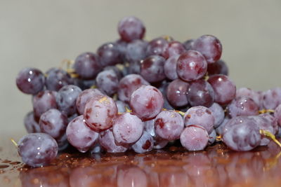 Close-up of grapes on table