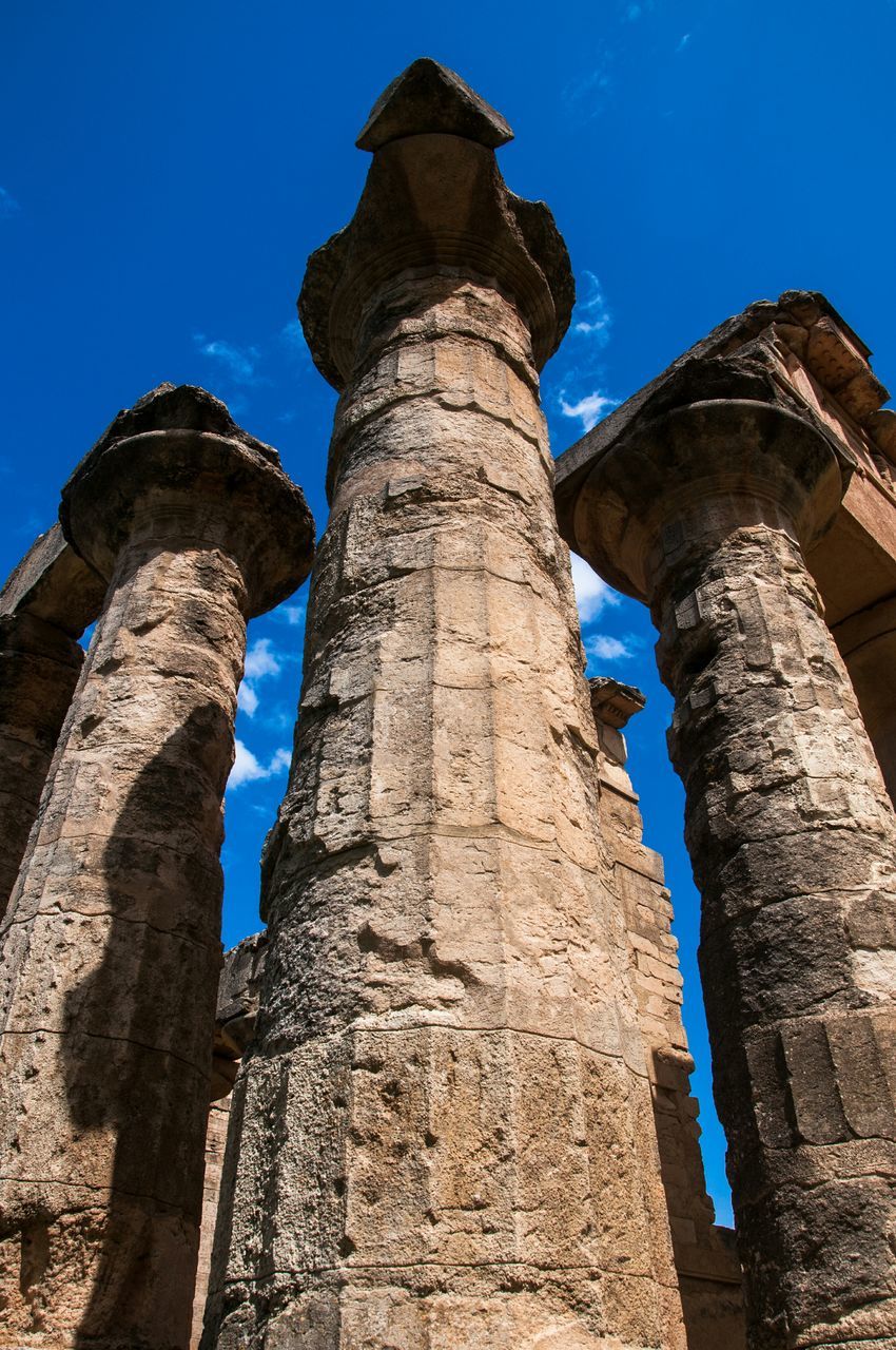 blue, low angle view, clear sky, architecture, built structure, history, old ruin, building exterior, the past, ancient, famous place, old, travel destinations, ancient civilization, sunlight, travel, tourism, international landmark, tower, sky