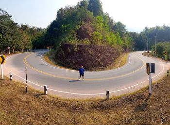 Portrait of man standing on road