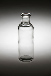 Close-up of bottle on gray background