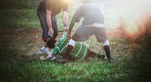 Low section of men on field