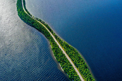 Aerial view of a road in the middle of a lake in finland