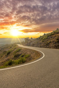 Road against sky during sunset