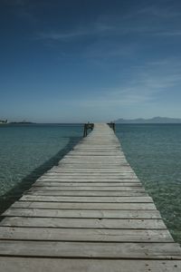 Pier over sea against sky