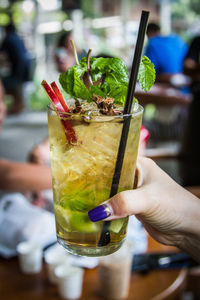 Close-up of hand holding drink