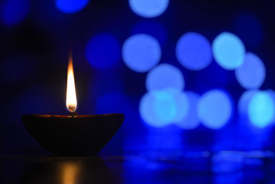 Close-up of illuminated lamp against blurred background