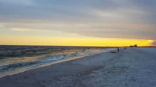 Scenic view of beach during sunset