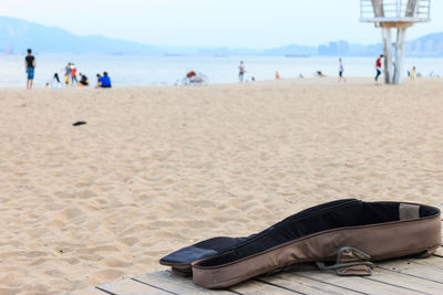 People relaxing on beach