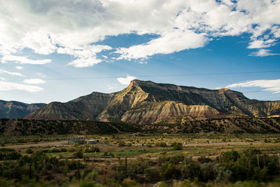 Scenic view of landscape and mountains against sky