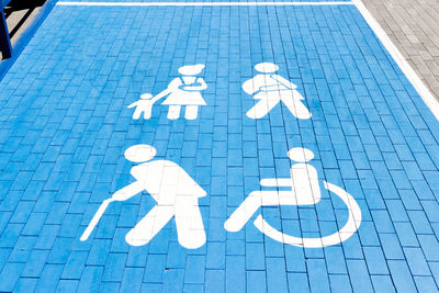 Sign, parking for the disabled in the parking lot of the shopping center