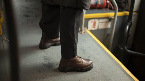 Brown shoes. man in shoes. man on bus. autumn boots.