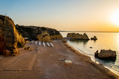 Scenic view of sea against clear sky during sunset