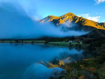 Scenic view of lake by mountains