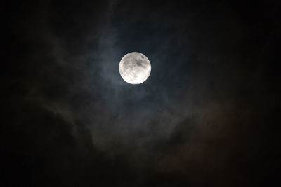 Low angle view of moon against sky at night